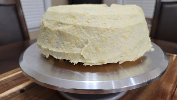 A cake sitting on top of a metal pan.