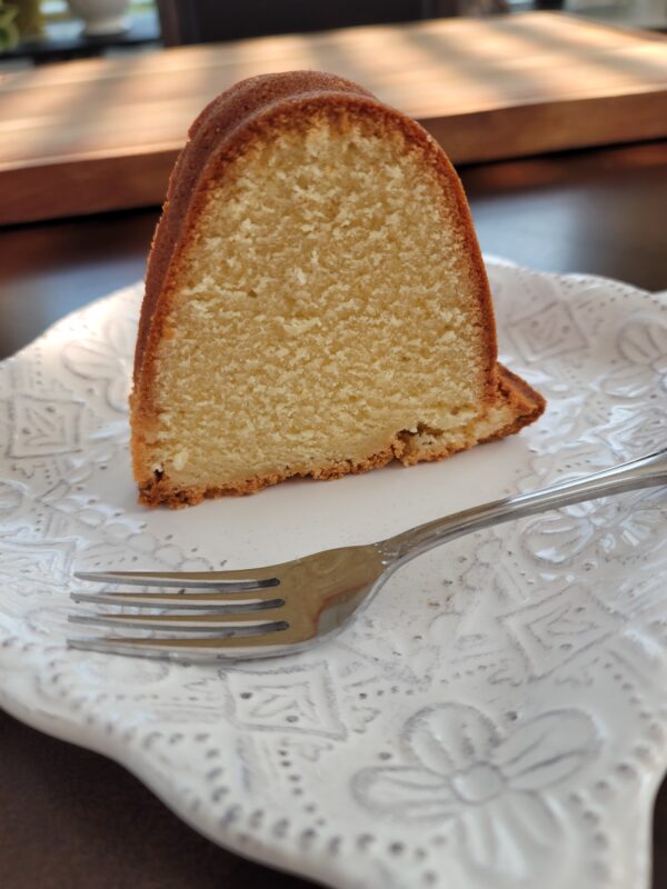 A piece of cake sitting on top of a white plate.