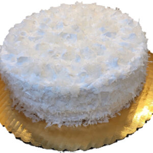 A white cake with coconut on top of it.