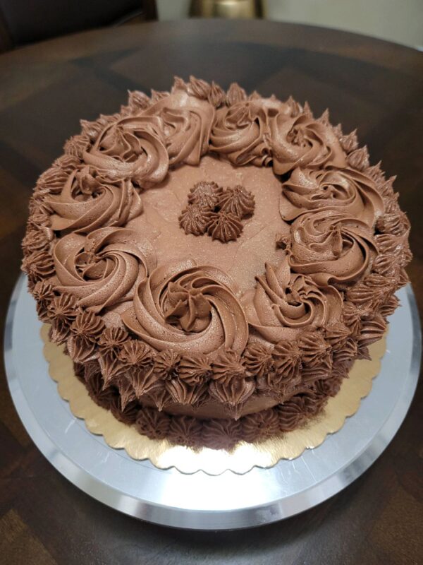 A chocolate cake with frosting on top of it.