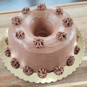 A chocolate cake with frosting on top of it.